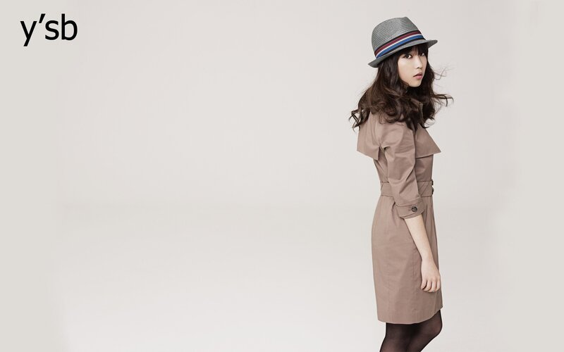 woman in trench coat and hat