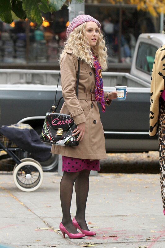 Woman in trench coat on street
