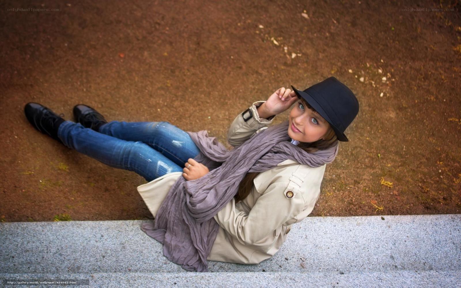 woman in trench coat sitting