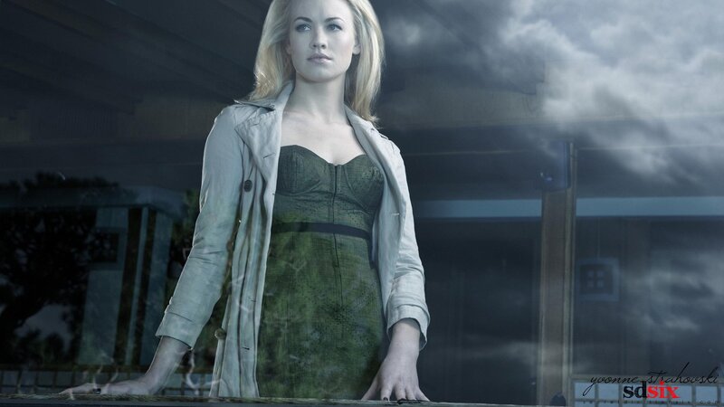 woman in trench coat standing