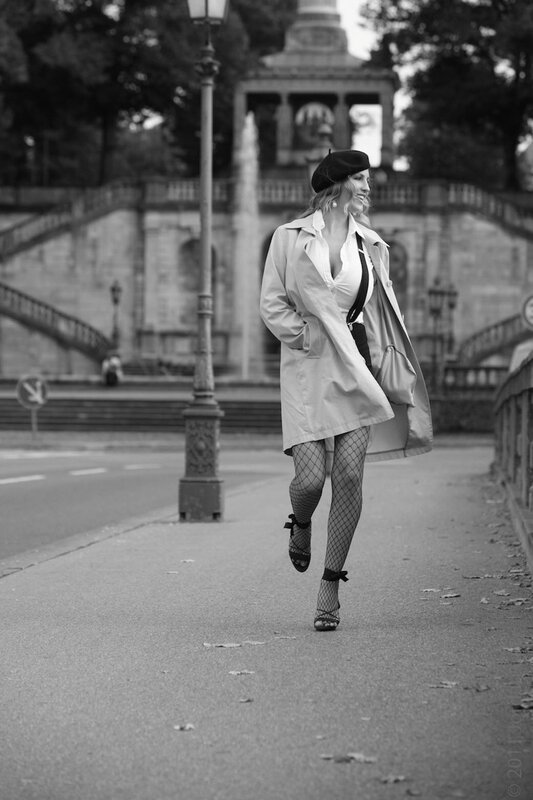 woman in trench coat walking
