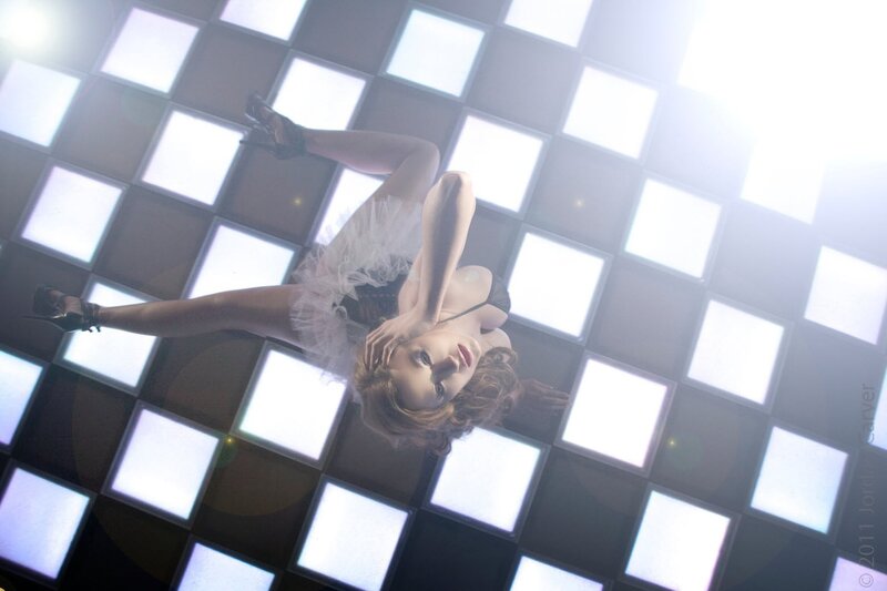 woman in tulle dress on lit floor