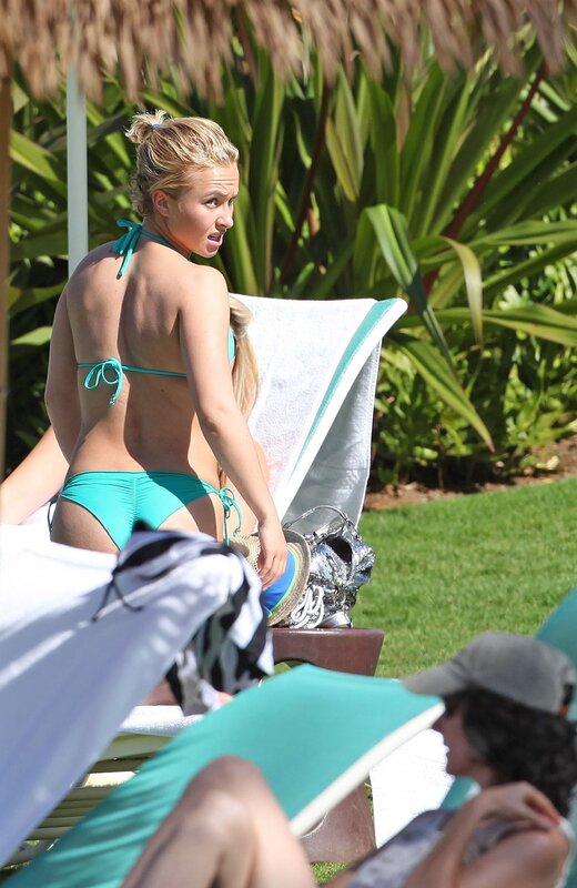 Woman in turquoise bikini at resort