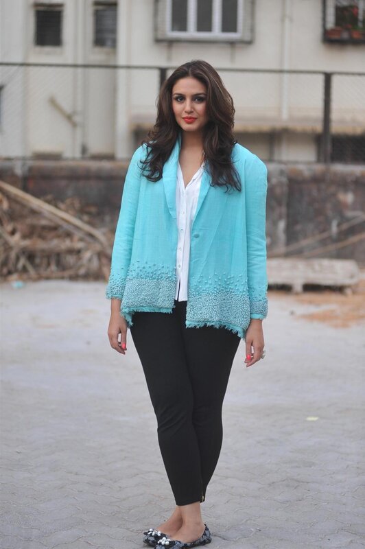Woman in turquoise blazer