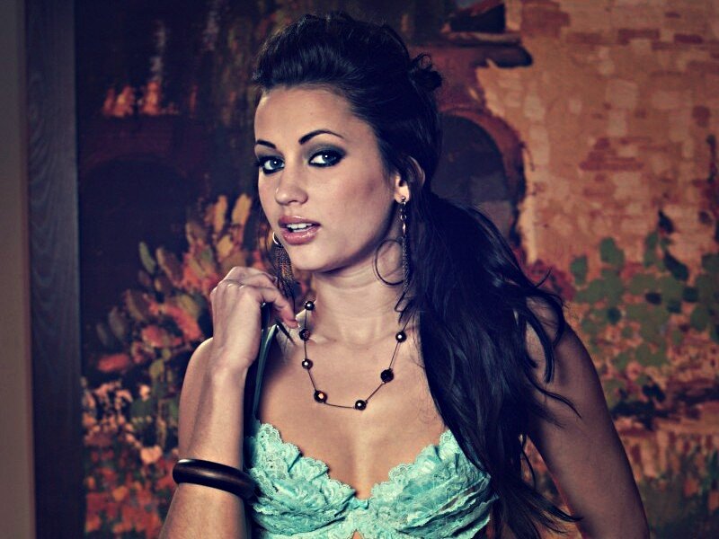 woman in turquoise lace top