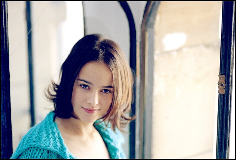 woman in turquoise sweater