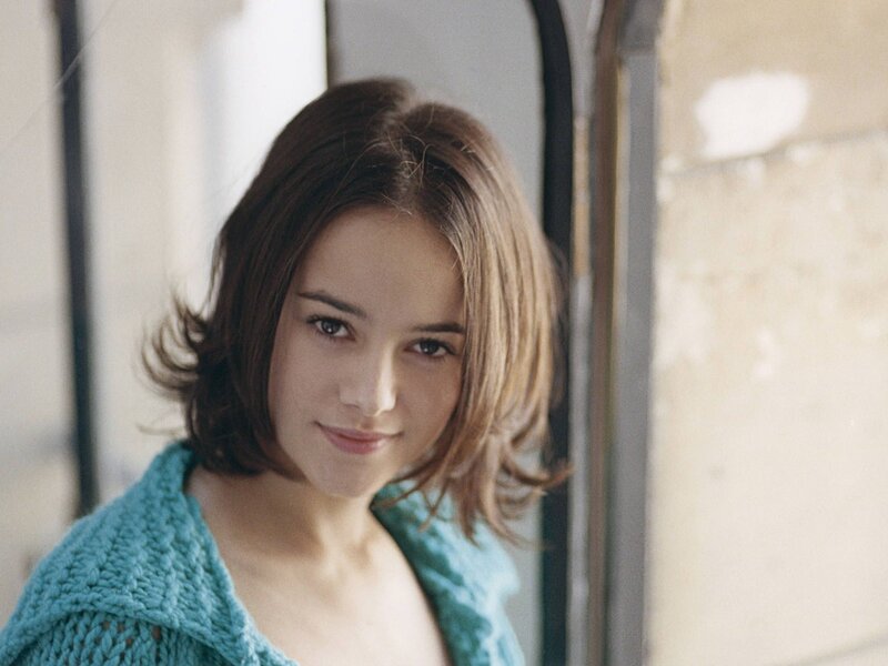 woman in turquoise sweater