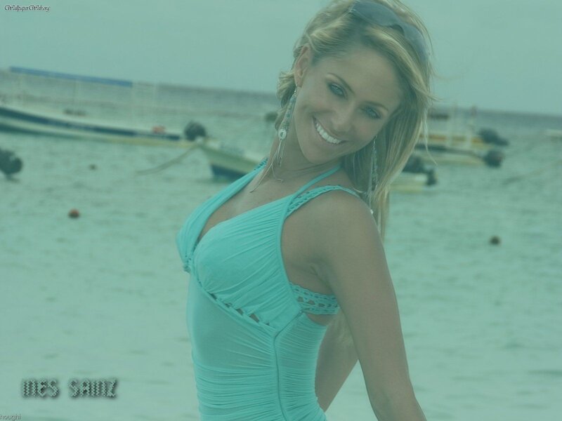 woman in turquoise swimsuit on beach