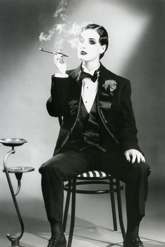 woman in tuxedo smoking cigar