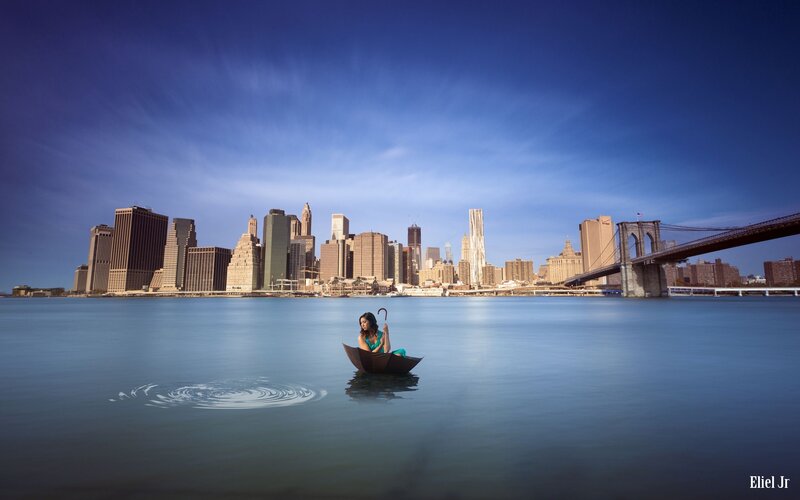 Woman in Umbrella Boat