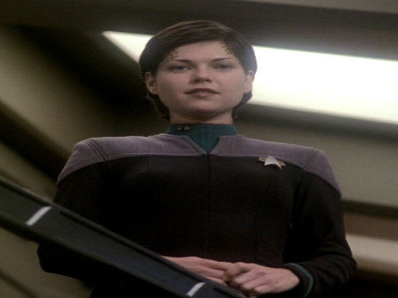 Woman in Uniform — Black, Serious