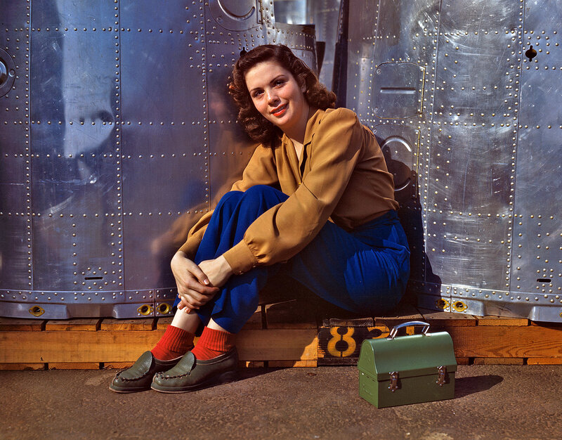 Woman in uniform by aircraft