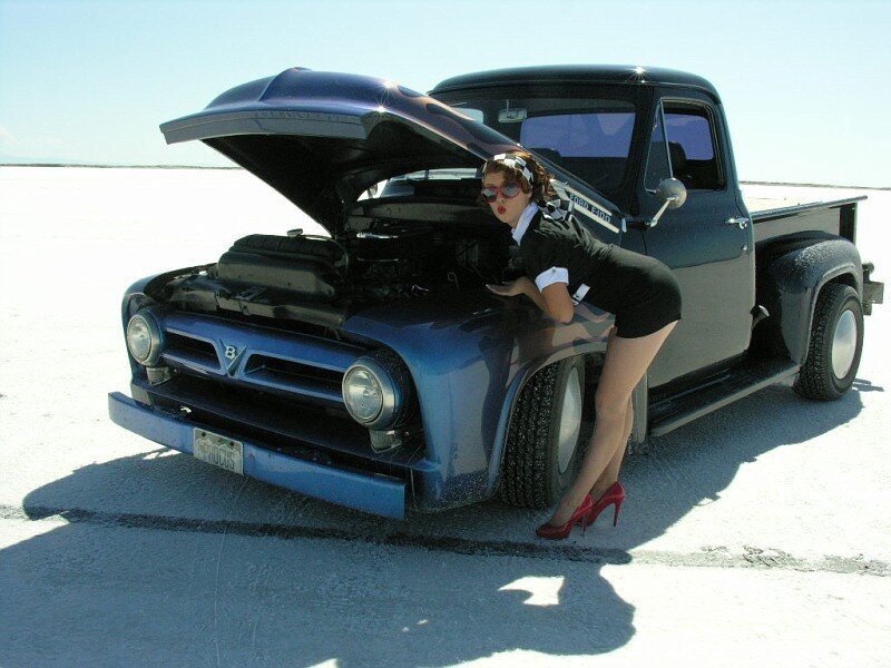 Woman in Uniform by Truck