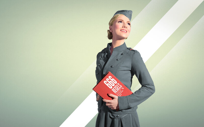 woman in uniform holding book