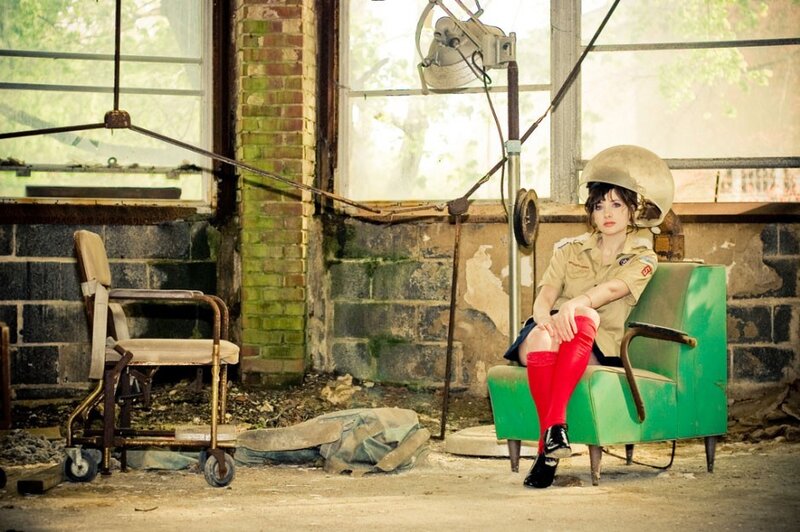 Woman in uniform in abandoned room