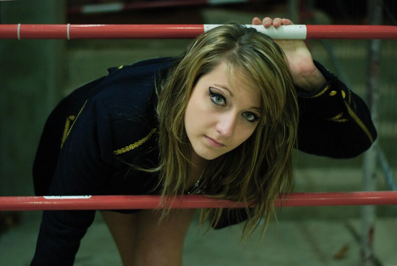 woman in uniform leaning on rail