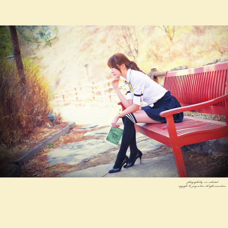 woman in uniform on bench