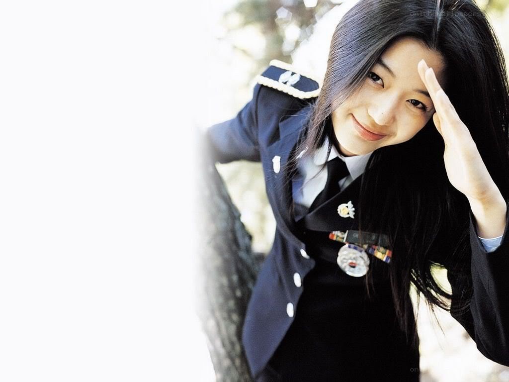 woman in uniform saluting
