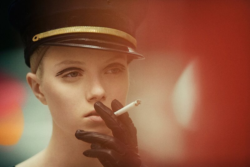woman in uniform smoking cigarette