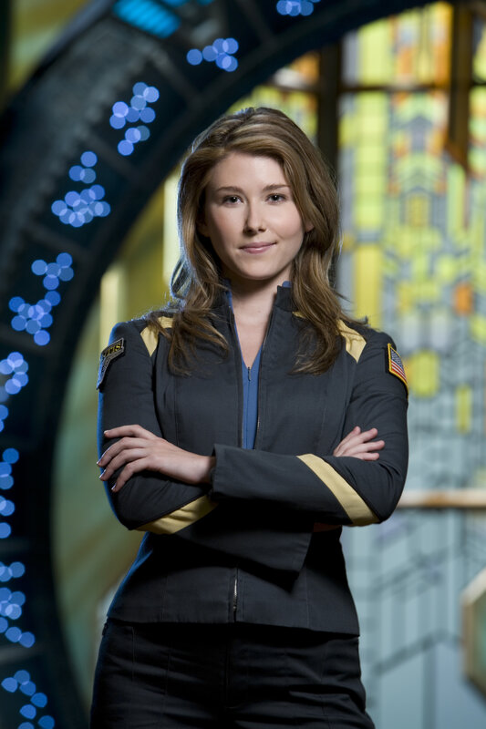 woman in uniform with arms crossed