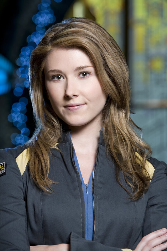 woman in uniform with arms crossed
