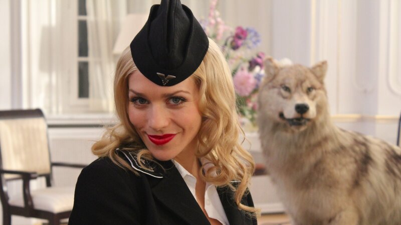 woman in uniform with wolf