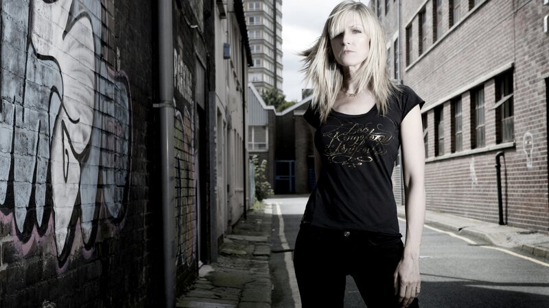 woman in urban alleyway
