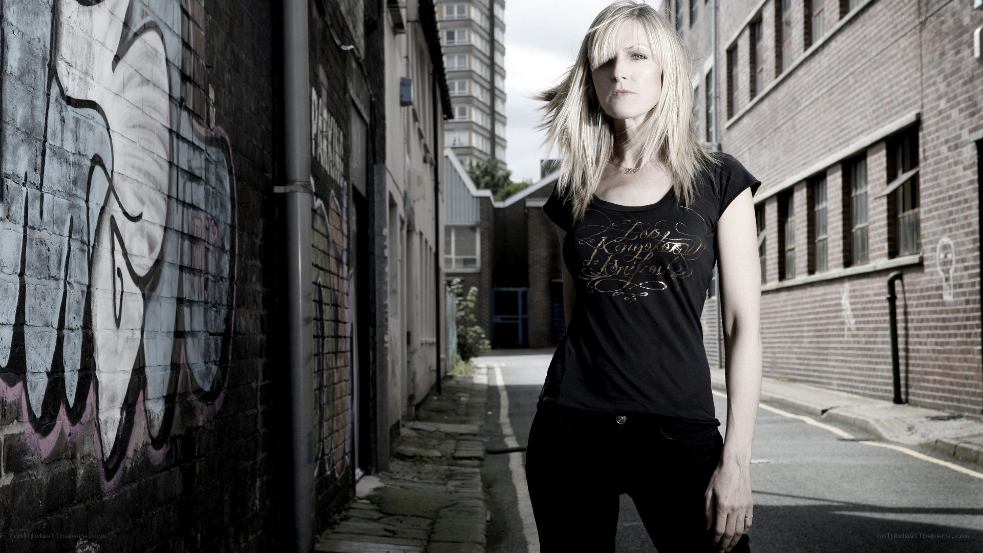 woman in urban alleyway