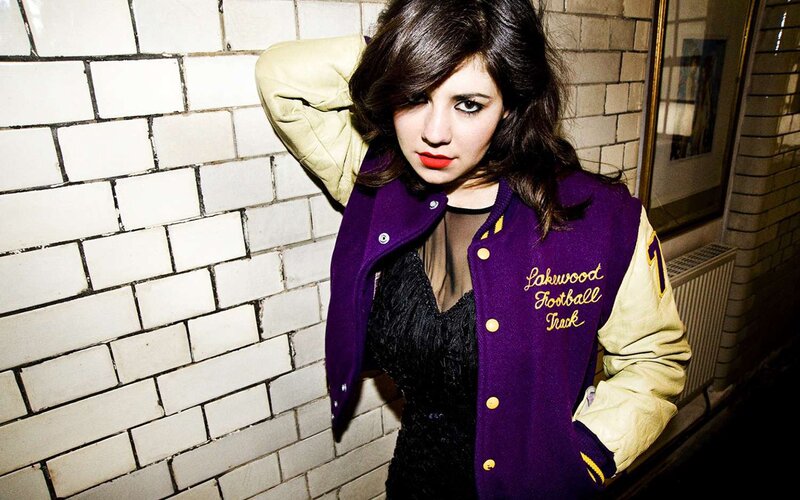 Woman in Varsity Jacket — Purple