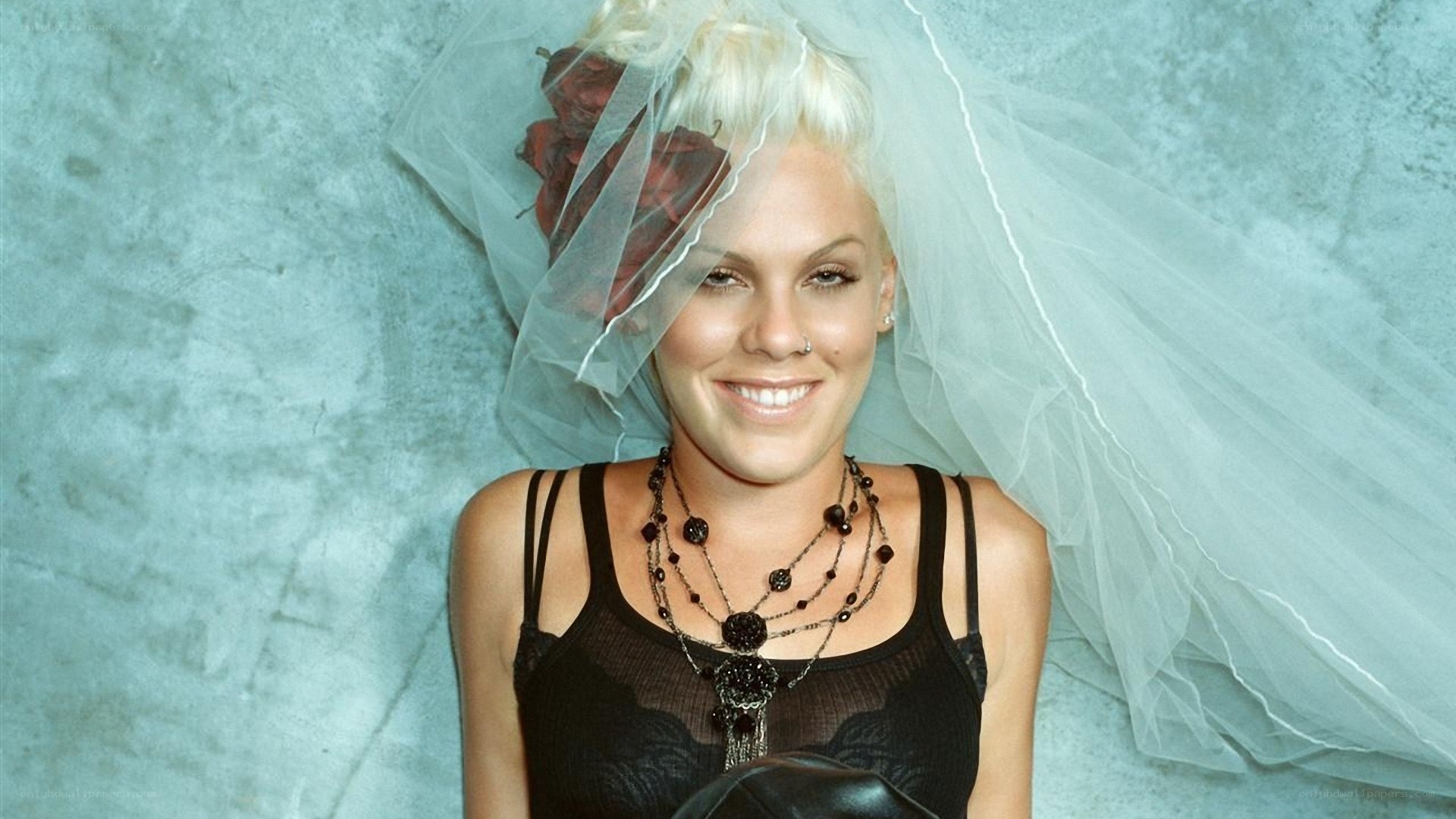 woman in veil and black top