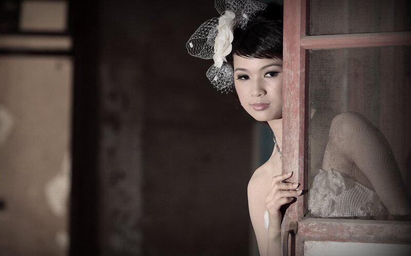 woman in veil by window