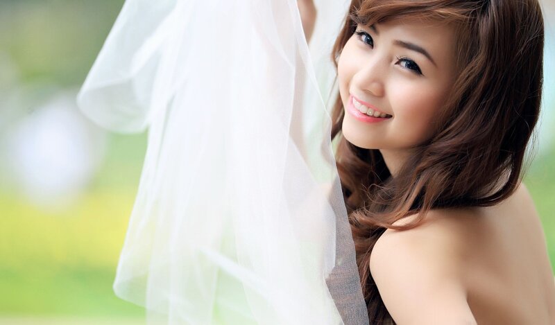 woman in veil smiling