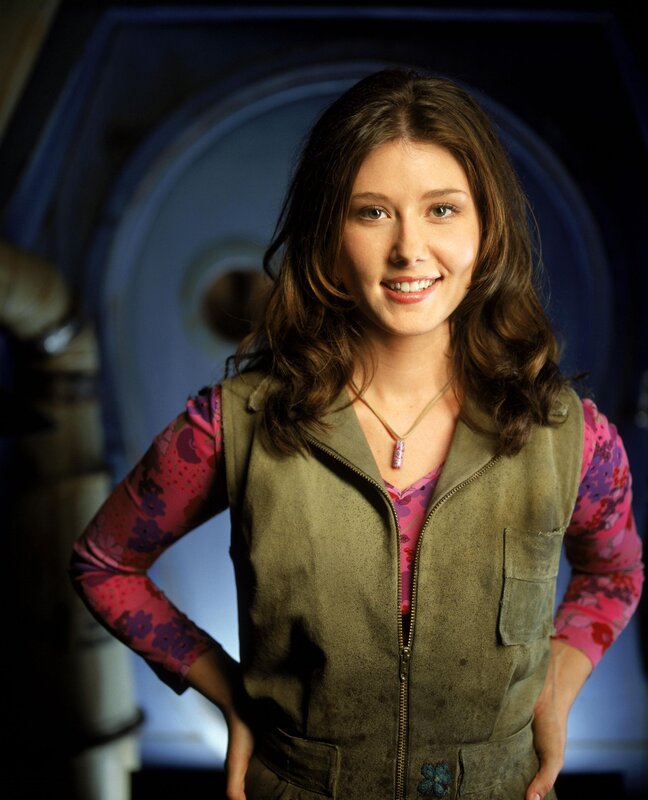 woman in vest smiling