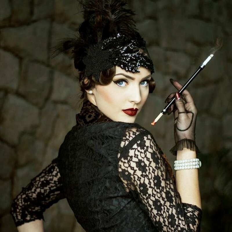 Woman in Vintage Attire — Black, Dramatic, Photograph, Feathered Headband, Cigarette Holder