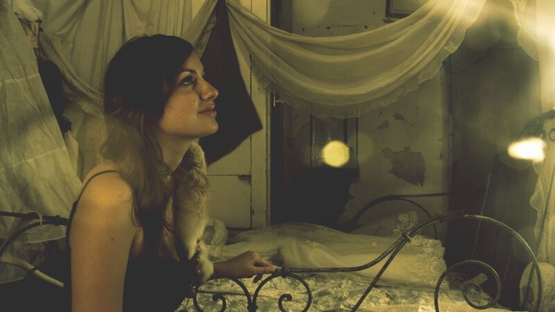 woman in vintage bedroom