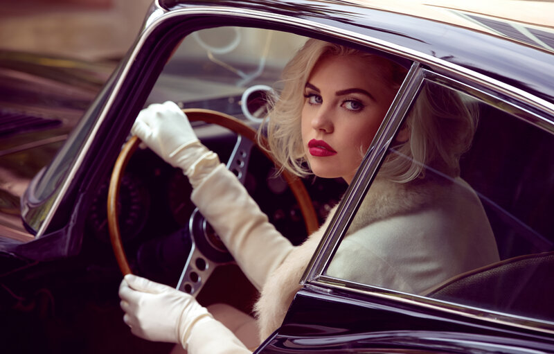 woman in vintage car