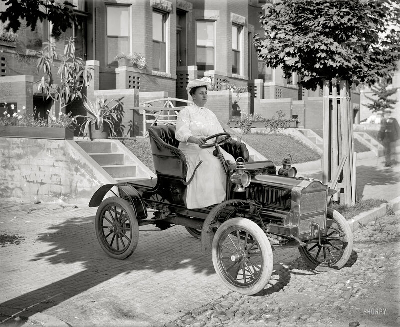 Woman in vintage car