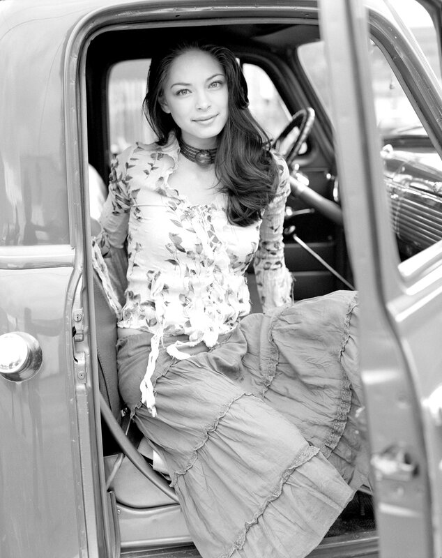 woman in vintage car