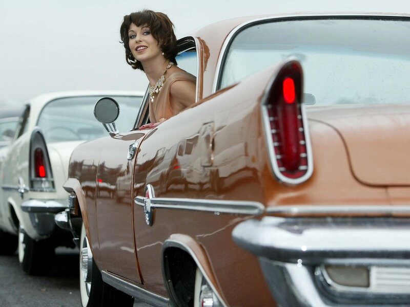 Woman in vintage car