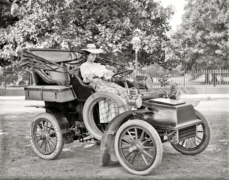 Woman in vintage car