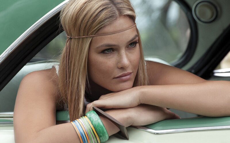 woman in vintage car