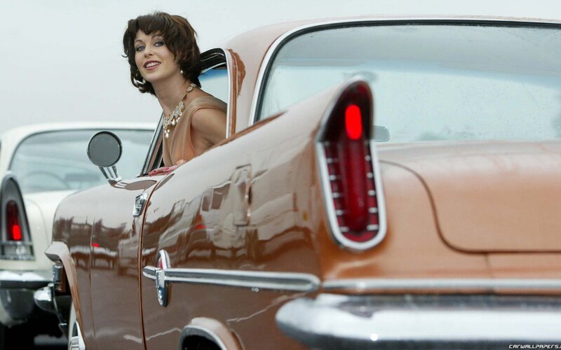 woman in vintage car