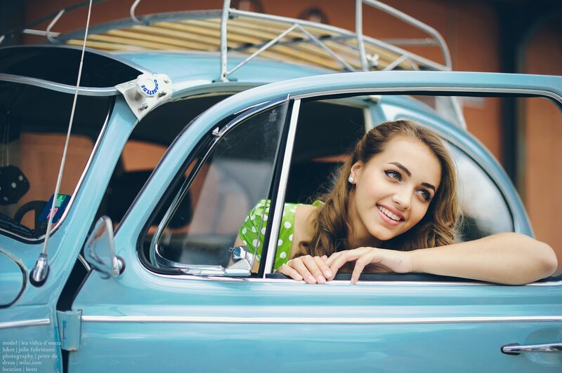 woman in vintage car