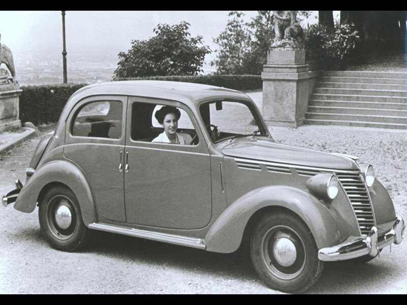 Woman in vintage car