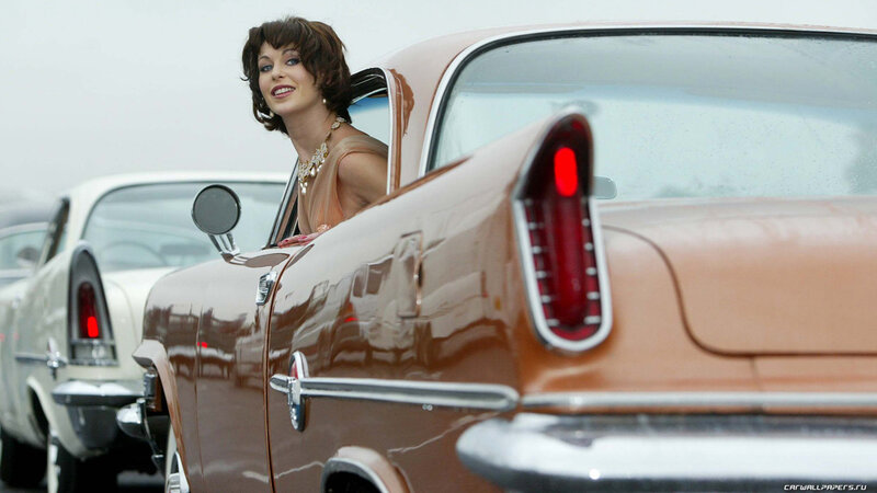 Woman in Vintage Car — Brown