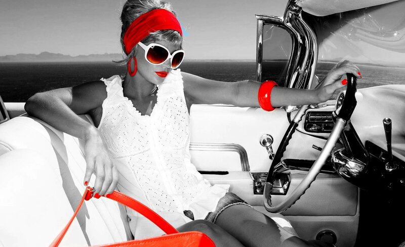 woman in vintage car with red accents