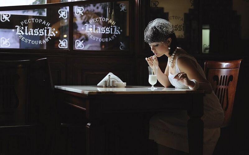 Woman in vintage dress at restaurant