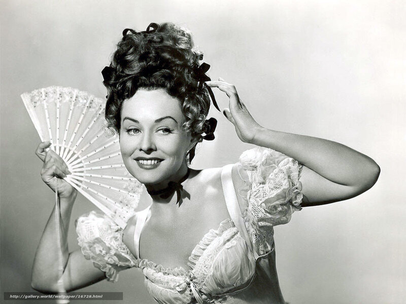Woman in vintage dress holding fan