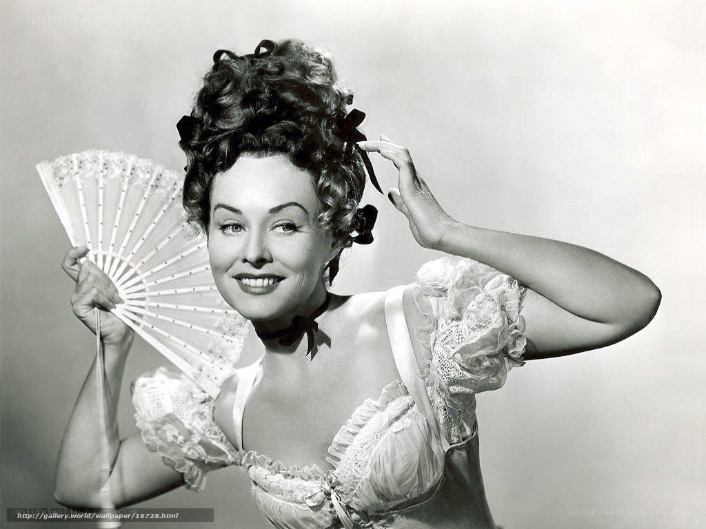 Woman in vintage dress holding fan