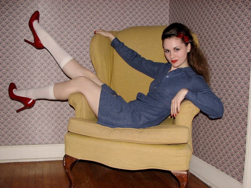 woman in vintage dress on armchair